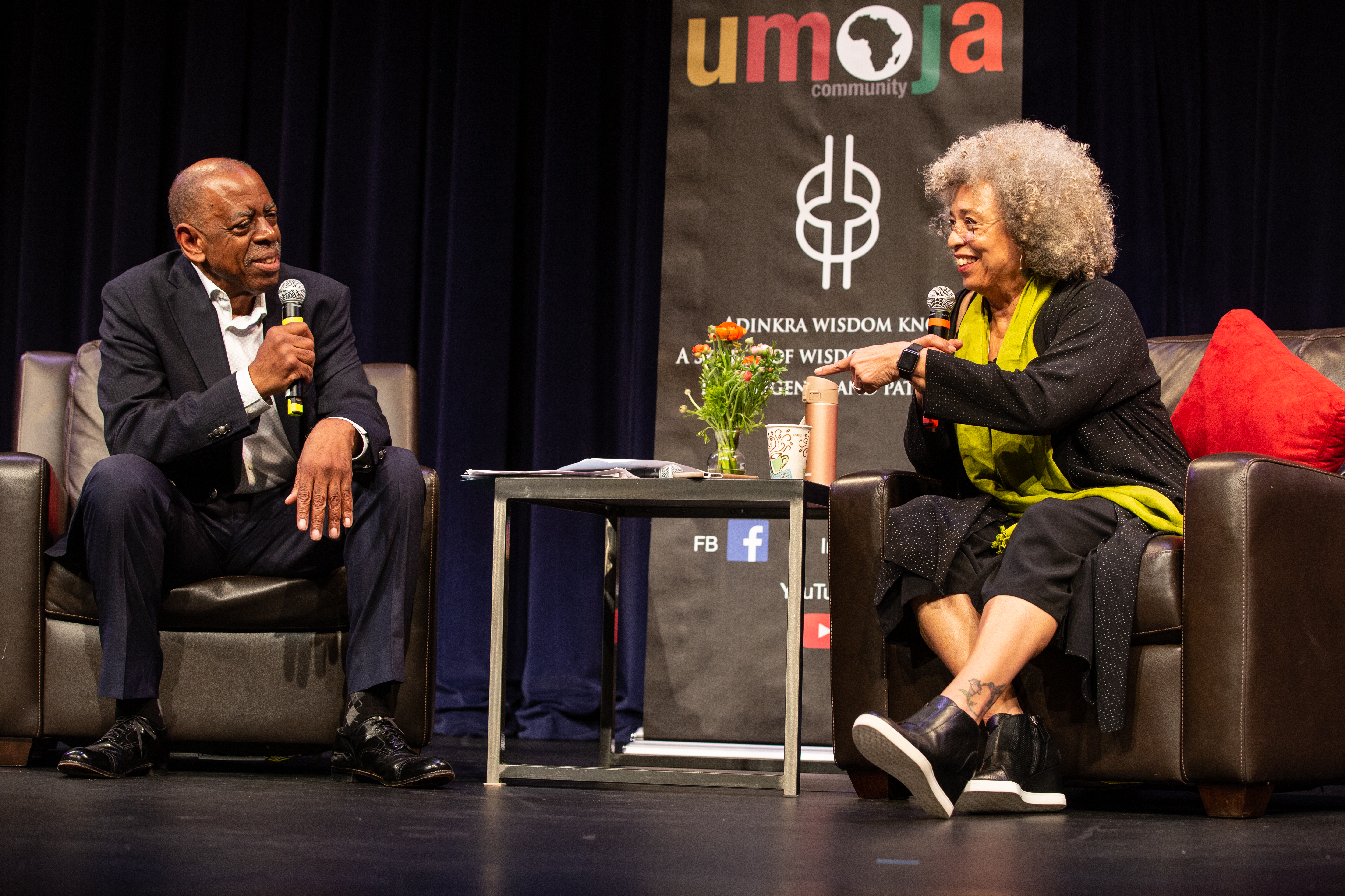 Angela Davis and Walter Turner talking on stage