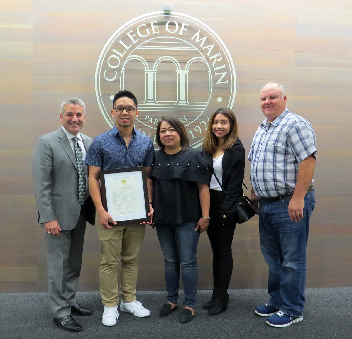 President David Wain Coon with student Mario Monte and family